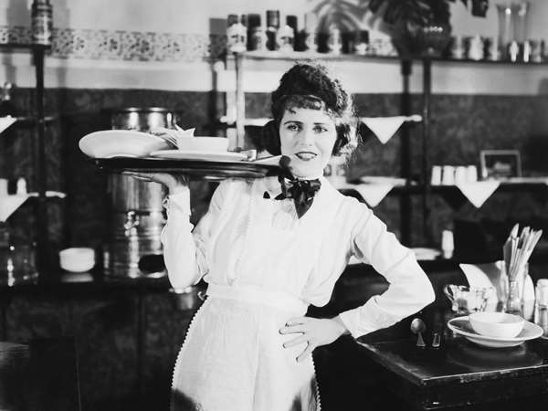 waitress with tray full of plates
