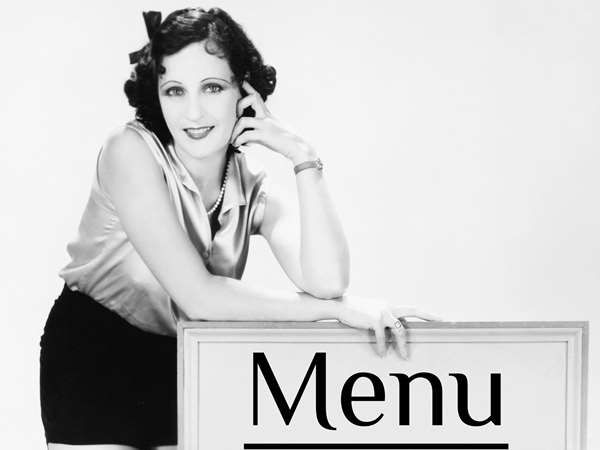 woman holding menu sign